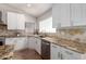 Well-appointed kitchen featuring granite countertops, stainless steel appliances, and ample cabinet space at 9154 E Caribbean Ln, Scottsdale, AZ 85260