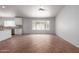 Bright living room with tile floors, soaring ceilings, and an abundance of natural light streaming through large windows at 9154 E Caribbean Ln, Scottsdale, AZ 85260