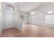Bright living room with tile floors, soaring ceilings, and an abundance of natural light streaming through large windows at 9154 E Caribbean Ln, Scottsdale, AZ 85260