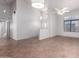 Bright living room with tile floors, soaring ceilings, and an abundance of natural light streaming through large windows at 9154 E Caribbean Ln, Scottsdale, AZ 85260