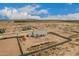 Aerial view of a new construction home with desert landscaping and block wall providing a private outdoor space at 9486 W Sandstone Mountain Dr, Casa Grande, AZ 85194