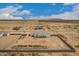 An aerial view shows a large home lot in a desert community during construction at 9486 W Sandstone Mountain Dr, Casa Grande, AZ 85194