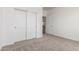 Bedroom with sliding doors and a regular door at 9486 W Sandstone Mountain Dr, Casa Grande, AZ 85194