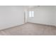 Spacious bedroom with neutral carpet and a bright window view at 9486 W Sandstone Mountain Dr, Casa Grande, AZ 85194