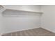 Walk-in closet with carpet and wooden shelf supports at 9486 W Sandstone Mountain Dr, Casa Grande, AZ 85194