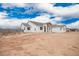 A charming single-story home showcases a stone-accented entry and a neutral-toned exterior at 9486 W Sandstone Mountain Dr, Casa Grande, AZ 85194