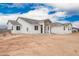 A charming single-story home showcases a stone-accented entry and a neutral-toned exterior at 9486 W Sandstone Mountain Dr, Casa Grande, AZ 85194