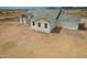 New construction home featuring a brick entryway, gray roof, white exterior and mountain views at 9486 W Sandstone Mountain Dr, Casa Grande, AZ 85194