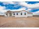 A bright single-story home features desert landscaping, stone accents, and an attached garage at 9486 W Sandstone Mountain Dr, Casa Grande, AZ 85194
