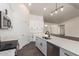 Stylish kitchen featuring white cabinets, quartz countertops, and stainless steel appliances at 9486 W Sandstone Mountain Dr, Casa Grande, AZ 85194