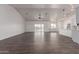 Spacious living room featuring wood-look flooring, plenty of light and ceiling fan at 9486 W Sandstone Mountain Dr, Casa Grande, AZ 85194