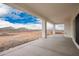 This is a covered patio with a view of the surrounding desert landscape and mountains at 9486 W Sandstone Mountain Dr, Casa Grande, AZ 85194