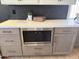 Stylish kitchen with stainless steel microwave, modern cabinetry, and quartz countertop at 9827 N Desert Rose Dr, Fountain Hills, AZ 85268