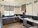 Well-lit kitchen featuring stainless steel appliances, quartz countertops, and custom cabinets at 9827 N Desert Rose Dr, Fountain Hills, AZ 85268