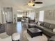 Bright and open living room with view of the kitchen and dining area at 9827 N Desert Rose Dr, Fountain Hills, AZ 85268