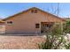 Backyard displays a neutral exterior, minimal landscaping, and partial view of the patio at 12238 W Monroe St, Avondale, AZ 85323