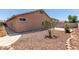 Backyard showing a neutral exterior, gravel landscaping, and a concrete patio at 12238 W Monroe St, Avondale, AZ 85323