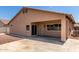 Cozy covered patio with a secure screen door perfect for outdoor relaxation and entertaining at 12238 W Monroe St, Avondale, AZ 85323