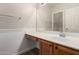 Bathroom features a vanity with a large mirror, drawers, and a sink at 12238 W Monroe St, Avondale, AZ 85323