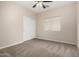 Bedroom offering carpeted floors, a ceiling fan, and a window with blinds at 12238 W Monroe St, Avondale, AZ 85323