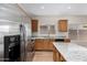 Bright kitchen featuring stainless steel appliances, granite countertops, and ample storage at 12238 W Monroe St, Avondale, AZ 85323