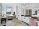 Spacious bathroom featuring marble floors, soaking tub with mountain views, and a modern vanity at 13209 N 17Th Pl, Phoenix, AZ 85022