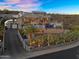 Beautiful desert home showcasing lush landscaping, cascading pool, and sleek, modern architecture at 13209 N 17Th Pl, Phoenix, AZ 85022