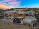 Contemporary home featuring a stunning pool with waterfall, desert landscaping, and expansive mountain views at 13209 N 17Th Pl, Phoenix, AZ 85022