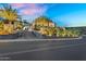 Luxurious estate featuring lighted landscaping, private driveway, and desert-modern architecture at twilight at 13209 N 17Th Pl, Phoenix, AZ 85022