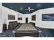 Spacious game room featuring a pool table, comfortable seating, and a unique themed carpet at 13209 N 17Th Pl, Phoenix, AZ 85022