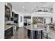 Modern kitchen boasting sleek cabinetry, stainless steel appliances, and a large center island at 13209 N 17Th Pl, Phoenix, AZ 85022