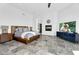 Serene main bedroom with a cozy fireplace, modern furnishings, and a luxurious ambiance at 13209 N 17Th Pl, Phoenix, AZ 85022