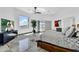 Bright main bedroom featuring a large window with views, modern decor, and a sleek TV cabinet at 13209 N 17Th Pl, Phoenix, AZ 85022