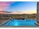 Infinity pool showcasing breathtaking mountain views, offering a serene and luxurious outdoor experience at 13209 N 17Th Pl, Phoenix, AZ 85022