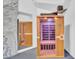 Modern home sauna room featuring a wood finish and glass door, perfect for relaxation and wellness at 13209 N 17Th Pl, Phoenix, AZ 85022
