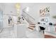 Bright and airy walk-in closet with marble floors, vanity and staircase at 13209 N 17Th Pl, Phoenix, AZ 85022