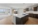 Contemporary kitchen features a large center island, modern appliances, and plenty of natural light at 13503 W Calle De Baca --, Peoria, AZ 85383