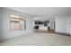 Open floor plan showcases bright living room next to a spacious, modern kitchen at 13503 W Calle De Baca --, Peoria, AZ 85383