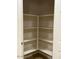 Spacious walk-in pantry with ample shelving for organized storage, perfect for any home chef at 18306 W Beck Ln, Surprise, AZ 85388