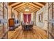 Elegant dining room featuring exposed beams, wood flooring, and ample seating at 20660 N 40Th St # 1089, Phoenix, AZ 85050