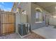Well maintained backyard covered patio featuring artificial grass and air conditioner at 2402 E 5Th St # 1621, Tempe, AZ 85288