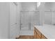 Bathroom with a tub-shower combination and glass doors, alongside a toilet and vanity at 2402 E 5Th St # 1621, Tempe, AZ 85288