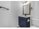 Stylish bathroom featuring a modern vanity with a marble countertop and a wood-framed mirror at 2402 E 5Th St # 1621, Tempe, AZ 85288