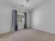 An airy bedroom with neutral carpet, window, curtains, and ample natural light at 2402 E 5Th St # 1621, Tempe, AZ 85288