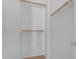 Interior view of a well-organized closet, complete with multiple shelves and hanging rods at 2402 E 5Th St # 1621, Tempe, AZ 85288