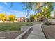 Beautifully landscaped common area with walkways, green spaces and mature trees at 2402 E 5Th St # 1621, Tempe, AZ 85288