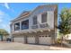 Inviting exterior showcasing a townhome with a balcony, gray stucco, and three-car garage at 2402 E 5Th St # 1621, Tempe, AZ 85288