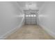 Two car garage featuring a white door and concrete floors at 2402 E 5Th St # 1621, Tempe, AZ 85288