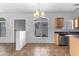 Open-concept kitchen flows into a living area with tile floors and natural lighting at 2402 E 5Th St # 1621, Tempe, AZ 85288