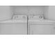 Laundry area featuring a white, side-by-side washer and dryer set at 2402 E 5Th St # 1621, Tempe, AZ 85288